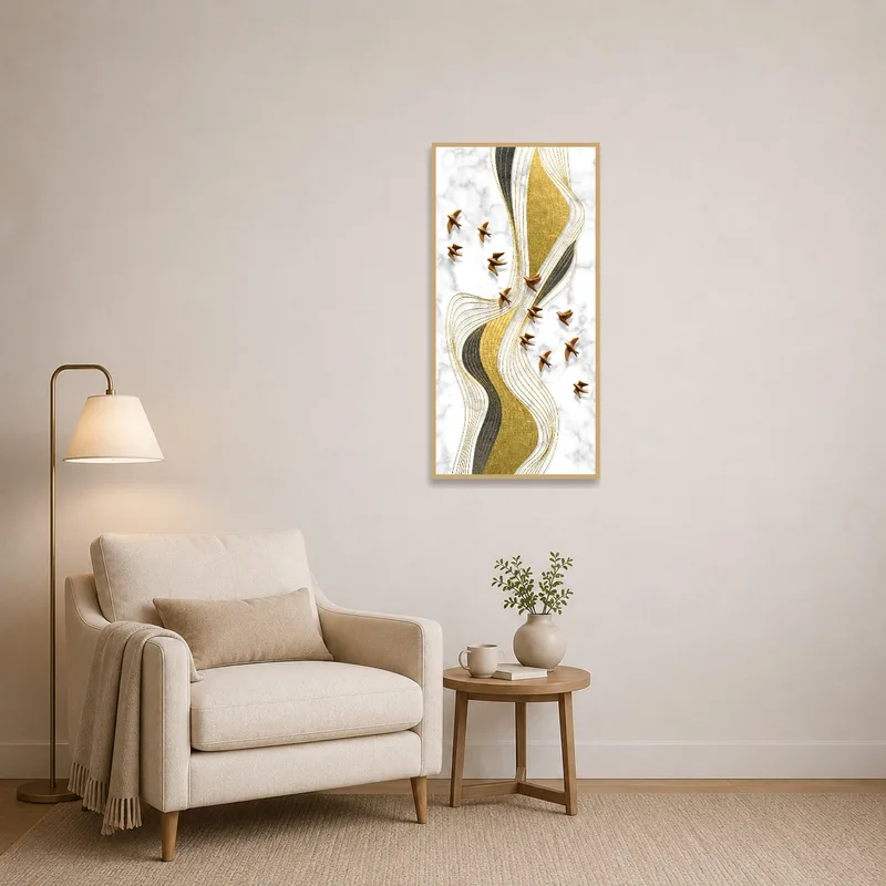 Reading corner displaying a gold and marble abstract art piece on the wall.