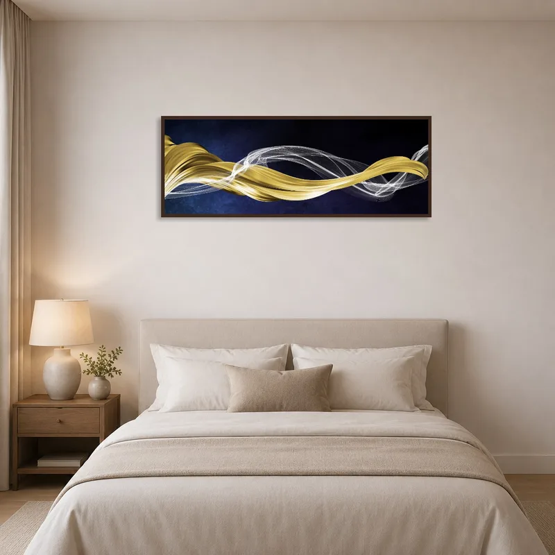 Elegant gold and silver abstract waves art above a bed in a bedroom, complementing a serene and stylish decor.