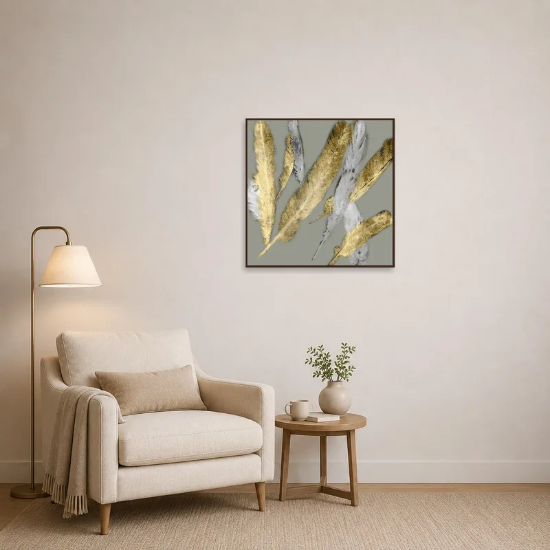Reading corner adorned with elegant feather artwork in gold and silver tones creating a cozy atmosphere.
