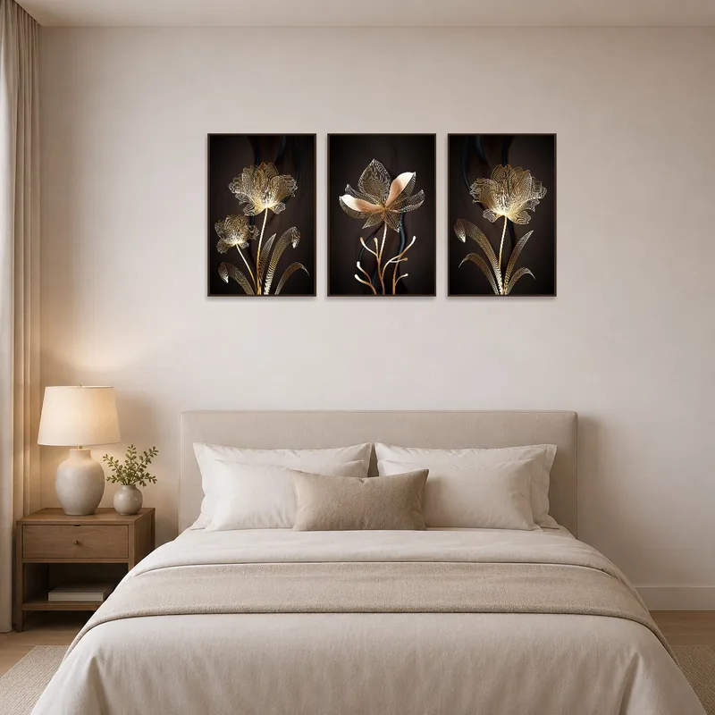 Golden botanical triptych enhances bedroom ambiance above a comfortable bed.