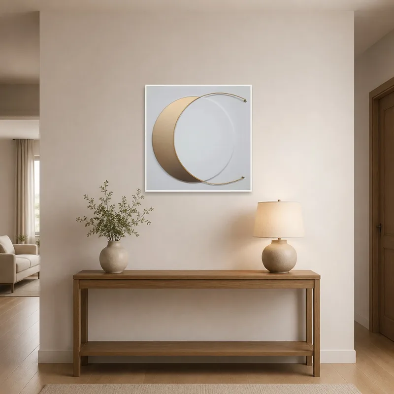 Art featuring a gold crescent hung in a stylish entrance hall.