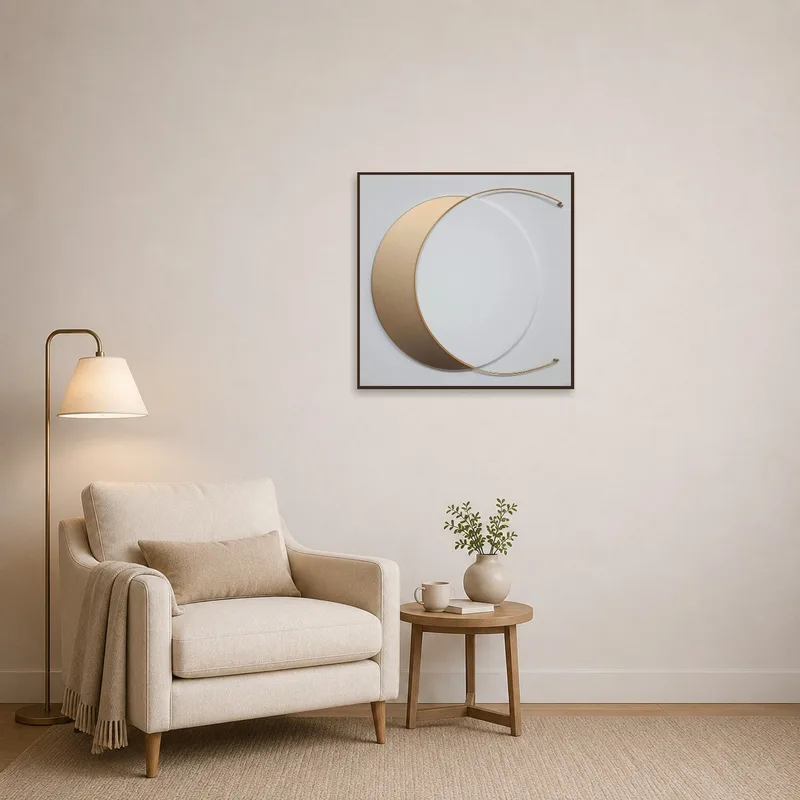 Gold crescent artwork next to a cozy chair in a reading corner.