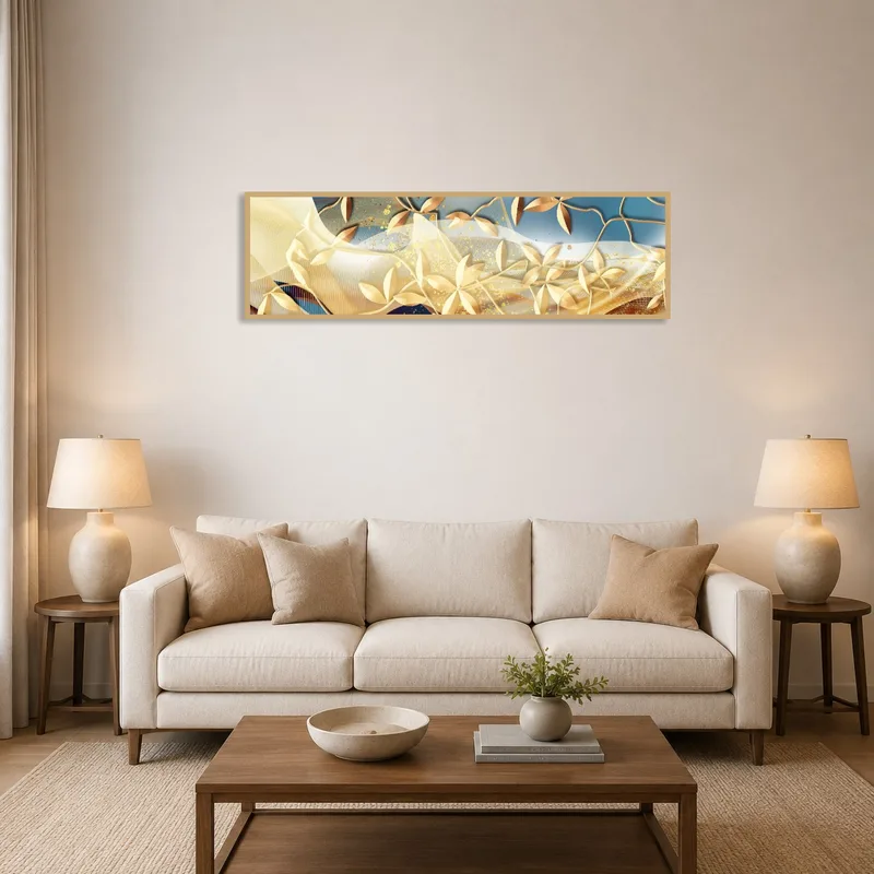 Gold leaf abstract art above a modern sofa with neutral tones in a living room.