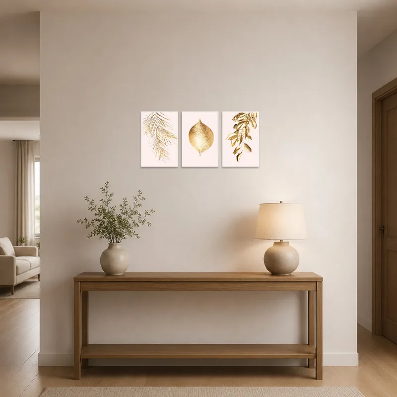 Gold leaf botanical art print set welcomes guests in the entrance hall with elegance.