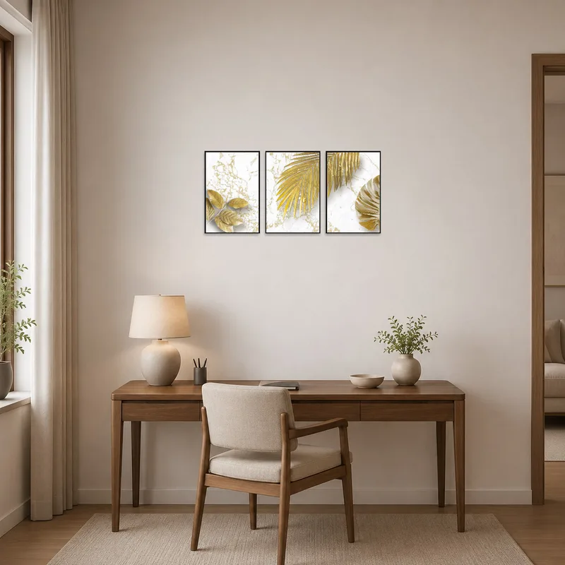 Gold leaf triptych on marble brings elegance to a modern home office space.