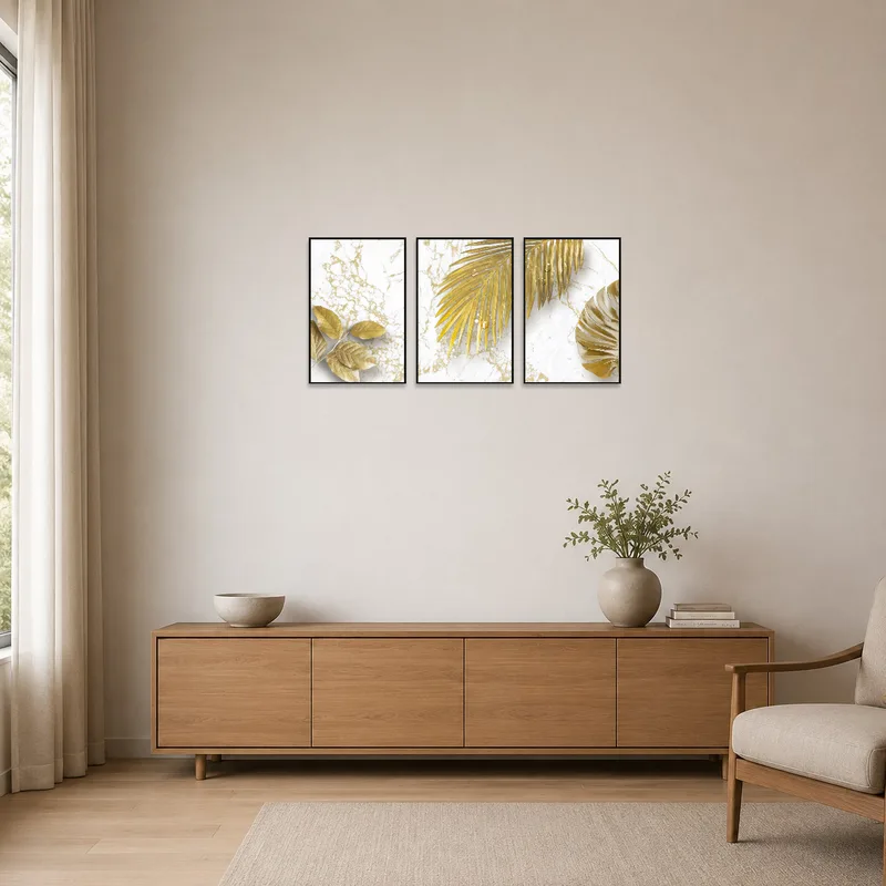 Sophisticated gold leaf triptych enhances a minimalist room.