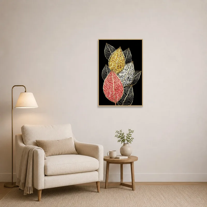Reading corner showcasing elegant gold vein leaf art on black canvas next to a comfy chair.