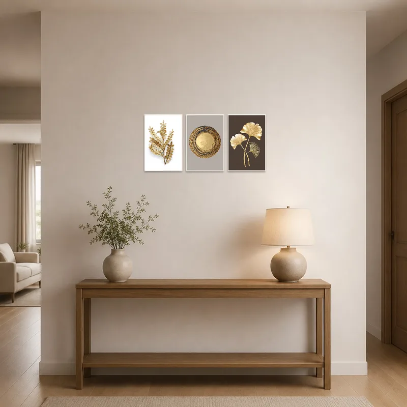 Triptych set highlighting the entrance hall with sleek golden leaf designs.