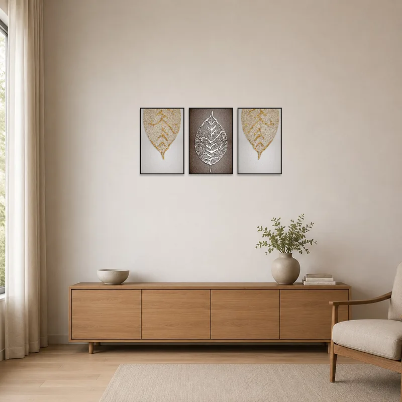 Minimalist room with three botanical prints of intricate leaf veins enhancing the simplicity.