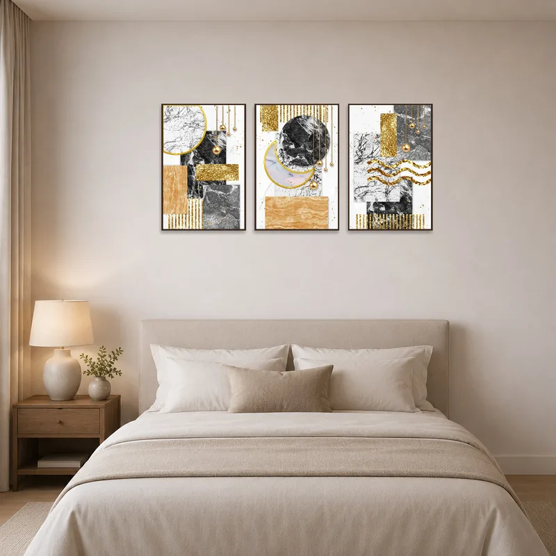 Elegant abstract pieces add luxury above a bed in the bedroom.