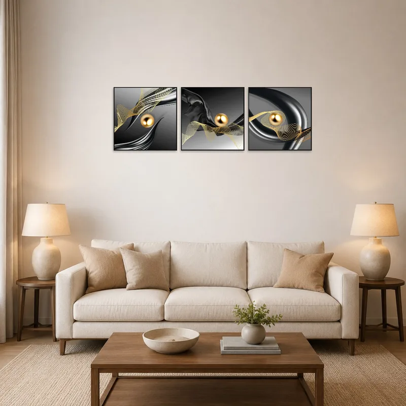Triptych of metallic and golden abstract art in a stylish living room.