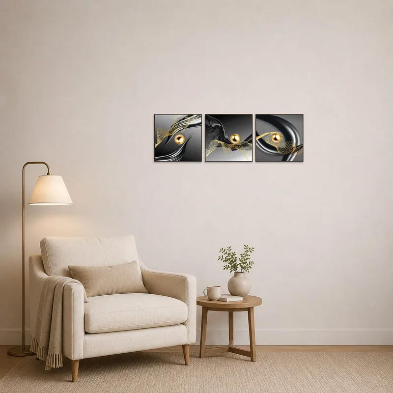 Elegant abstract triptych adds flair to a cozy reading corner.