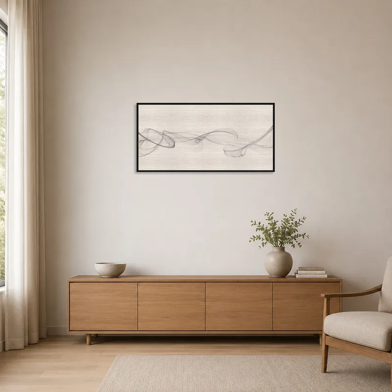Black and white wave art accentuating minimalist room with clean lines.