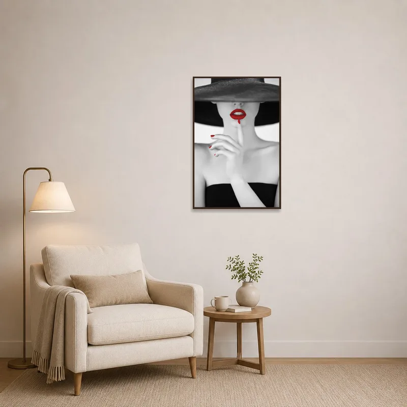 Reading corner adorned with a striking monochrome portrait with red.