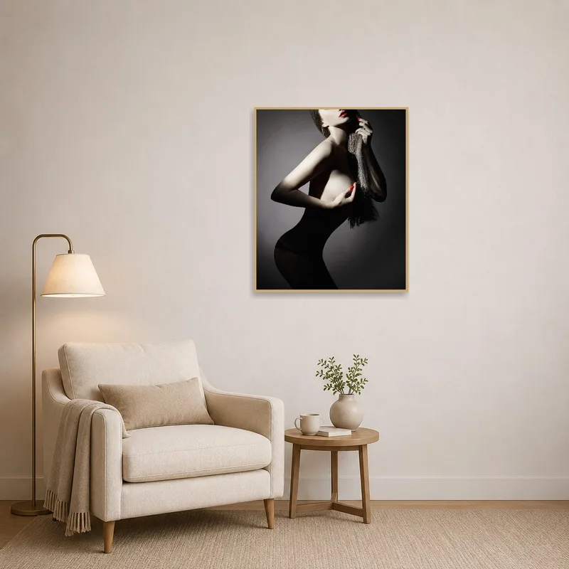 Reading corner showcasing elegant nude silhouette art with bold shadow contrasts.