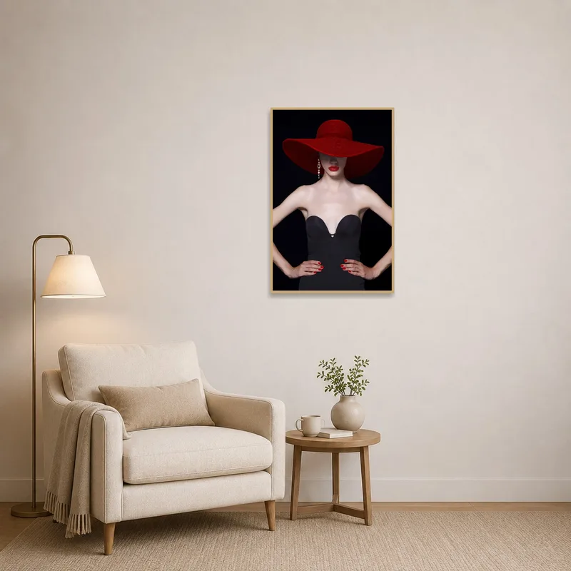 Elegant artwork with a red hat adds flair to a cozy reading corner.
