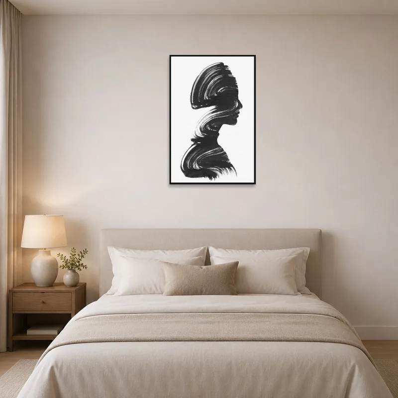 Elegant silhouette brushstroke art print adorning a tranquil bedroom wall.