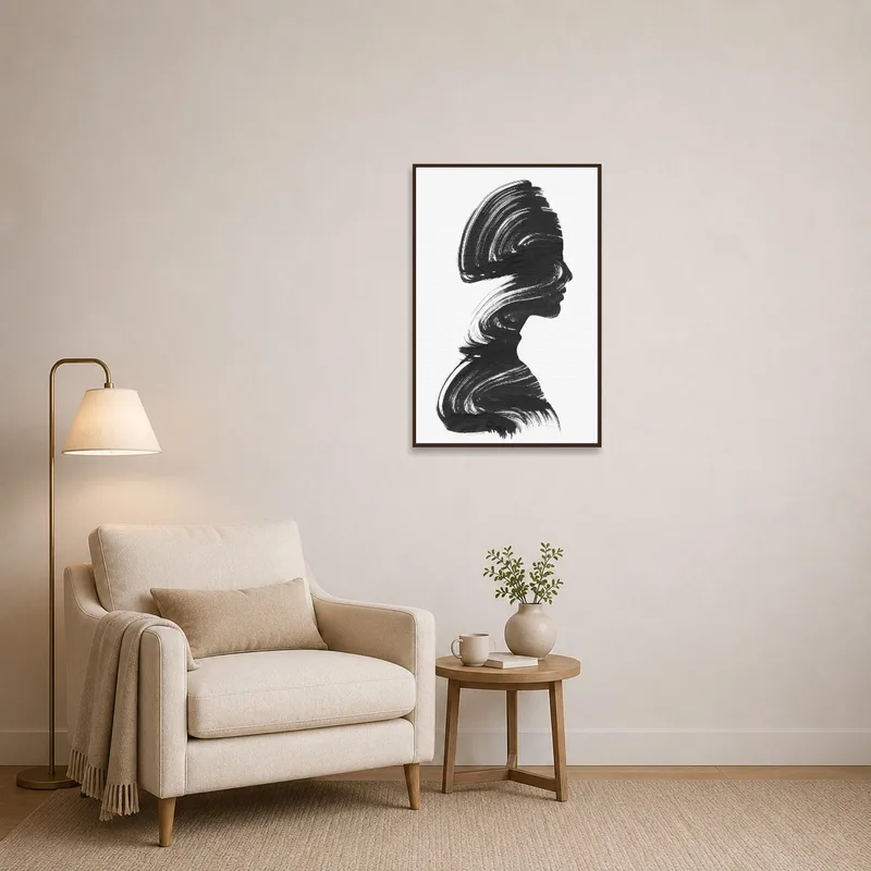 Cozy reading corner enhanced by elegant silhouette brushstroke art print.