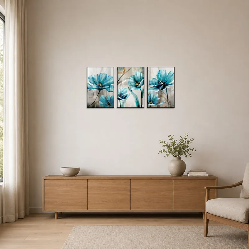 Triptych with teal flowers complements a minimalist room decor.