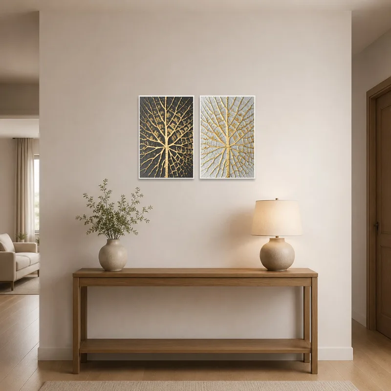 A set of elegant gold leaf art pieces adorns the entrance hall, offering a welcoming touch.