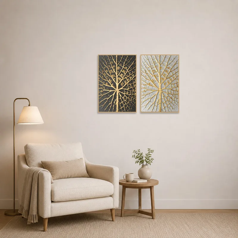 Gold leaf artwork set enhances the cozy atmosphere of a reading corner with a touch of texture.