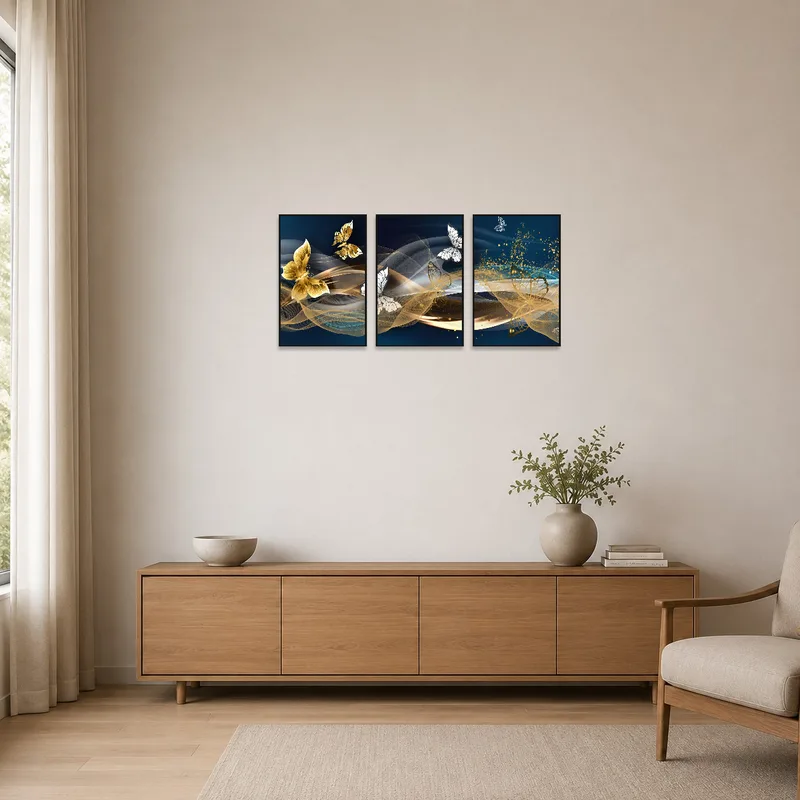 Golden butterfly triptych enhances a minimalist setting with subtle elegance.
