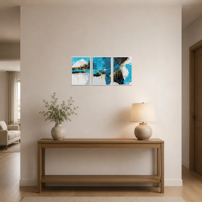 Abstract triptych with blue and gold tones in an elegant entrance hall.