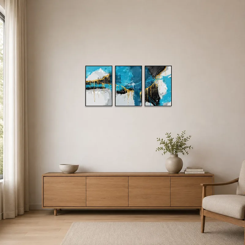 Blue and gold abstract triptych enhancing a minimalist room space.