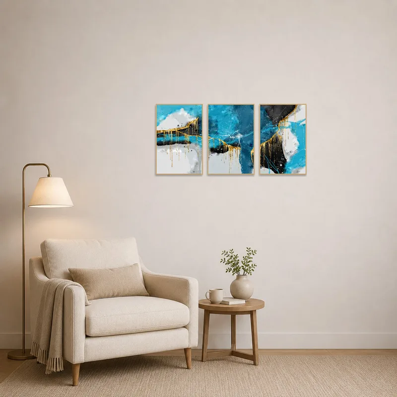 Sophisticated blue and gold abstract triptych in a cozy reading corner.