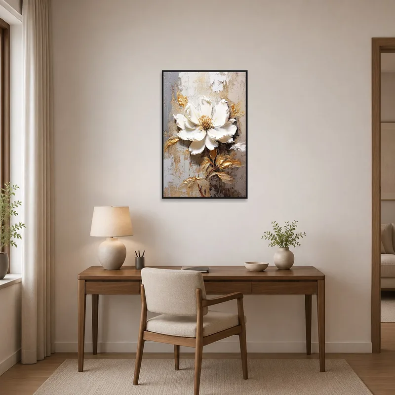 Sophisticated white bloom and gold art brighten a workspace with a tidy desk.