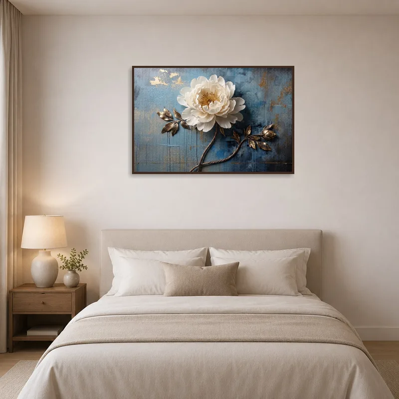 Bedroom sanctuary accented by white flower art on textured blue.