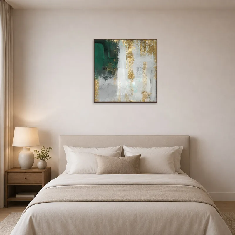 Abstract emerald and gold artwork brightens a tranquil bedroom setting.