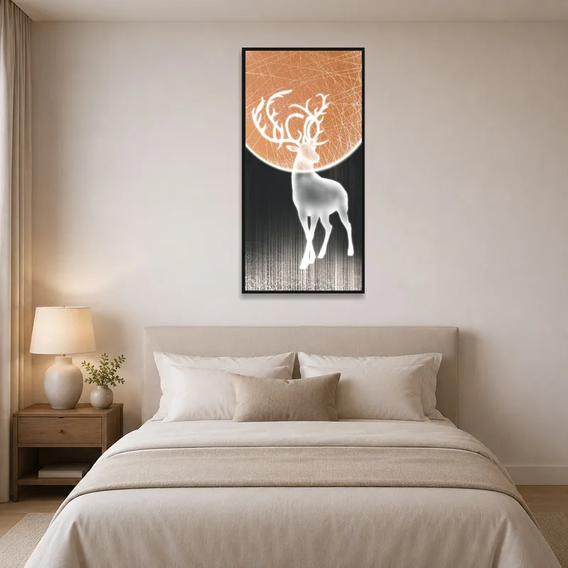 A peaceful art piece of a deer and moon hung above a bed.