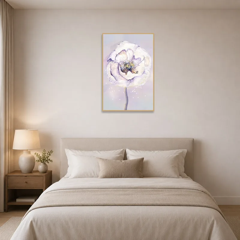 Soft-hued floral artwork brings tranquility to the bedroom.