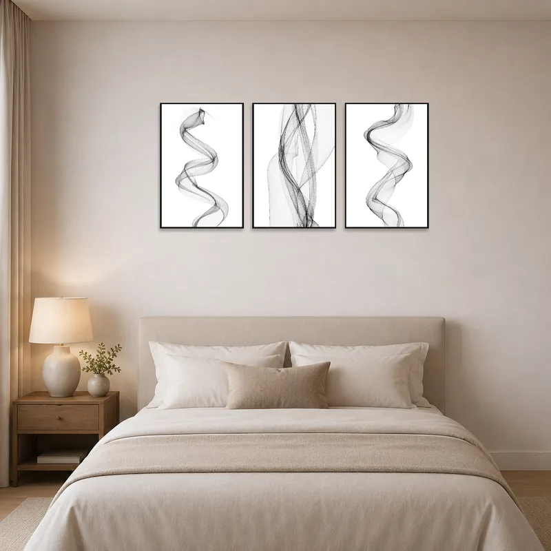 Serene triptych complements the calming atmosphere of the bedroom.