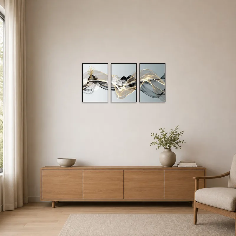 Gold-accented triptych serves as a focal point in a minimalist room.