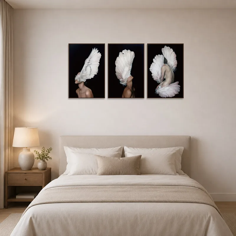 A calming triptych of wings creates a peaceful vibe in the bedroom.