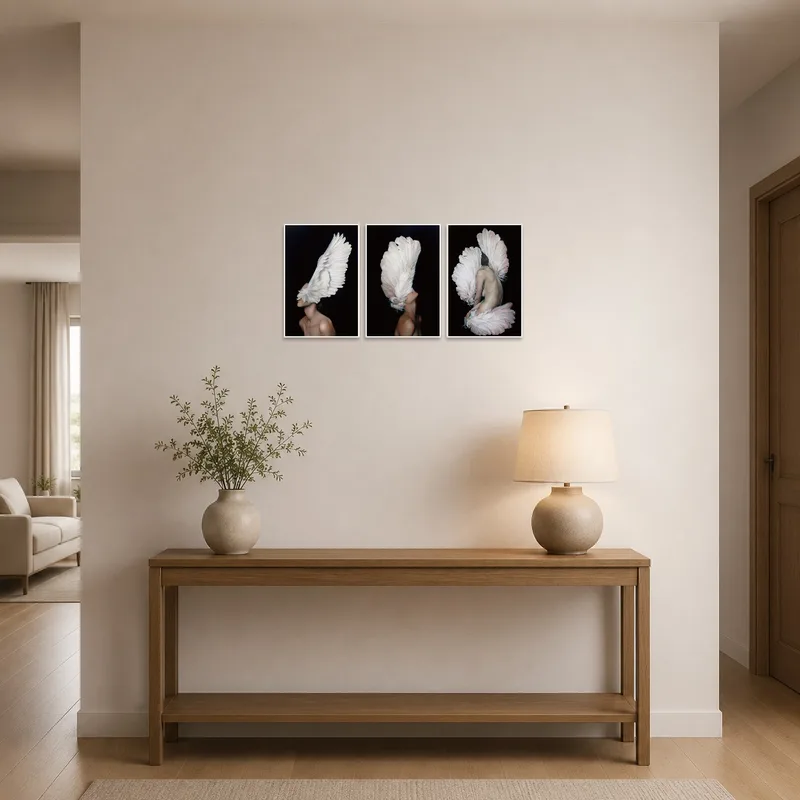 A sophisticated triptych of winged elegance greets guests in the entrance hall.