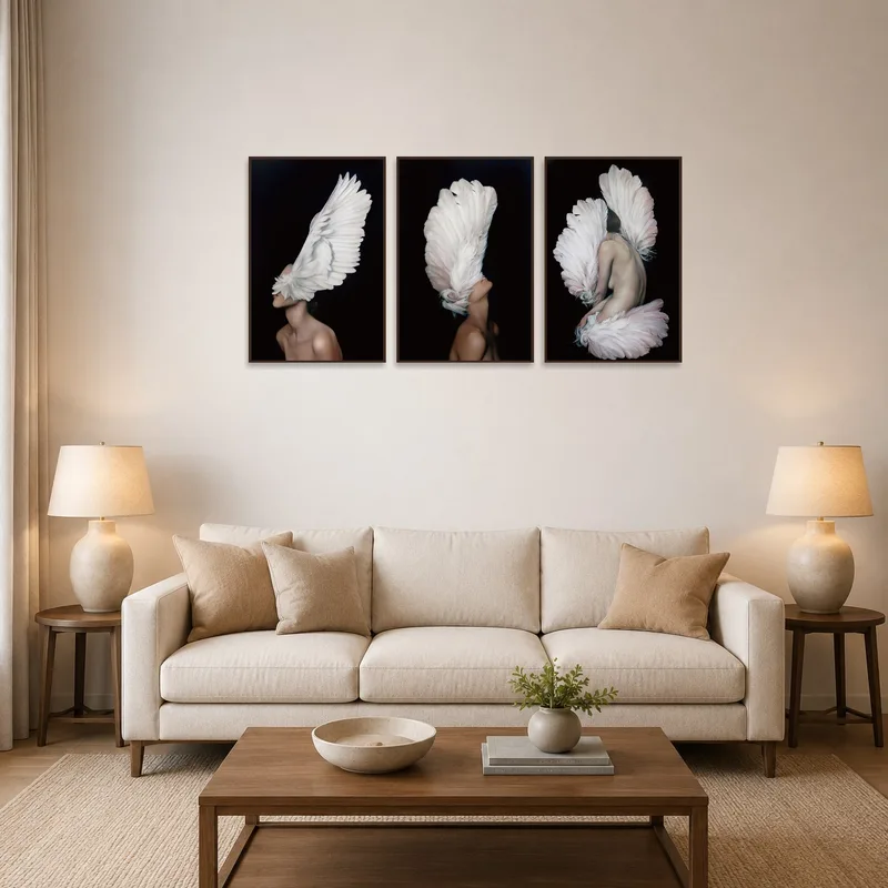 A serene triptych depicting elegant wings enhances the living room's calming atmosphere.