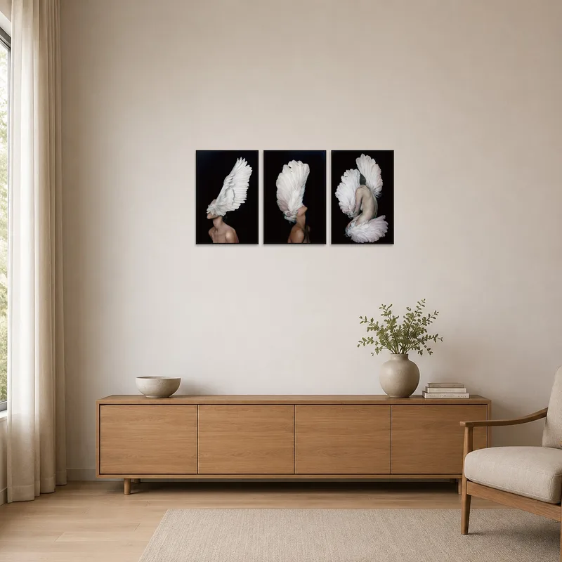 The ethereal triptych of elegant wings adds subtle beauty to the minimalist room.