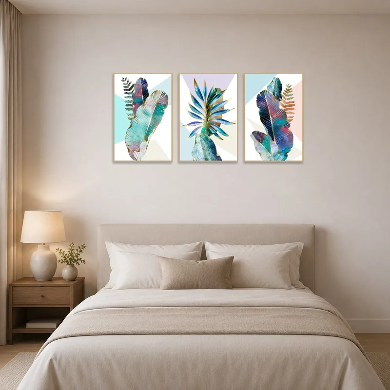 Bedroom wall showcases a botanical feather triptych, adding a soothing atmosphere.