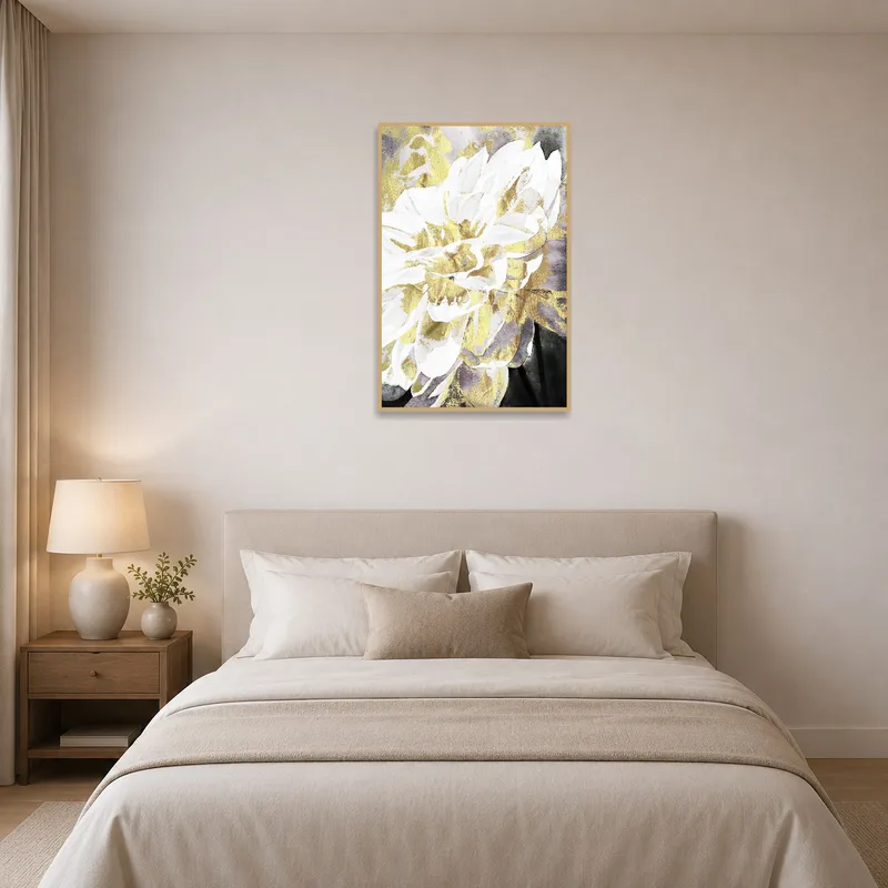 Gold and white flowers on bedroom wall above a neatly made bed.