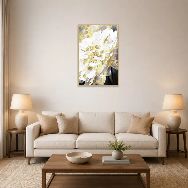 Gold and white floral artwork above a cozy living room sofa.