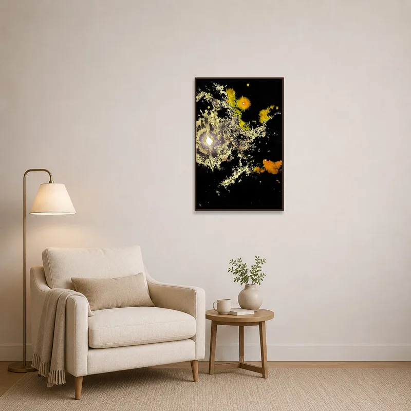 Abstract cosmic print above a cozy chair in a reading nook.