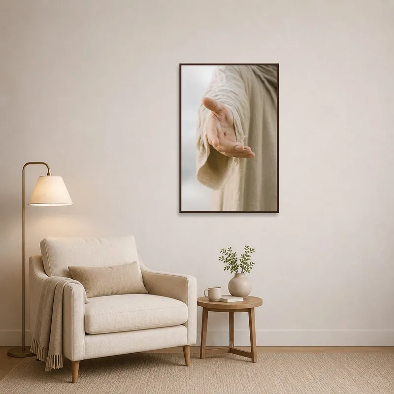 Inviting hand gesture art hangs near a comfortable reading chair.