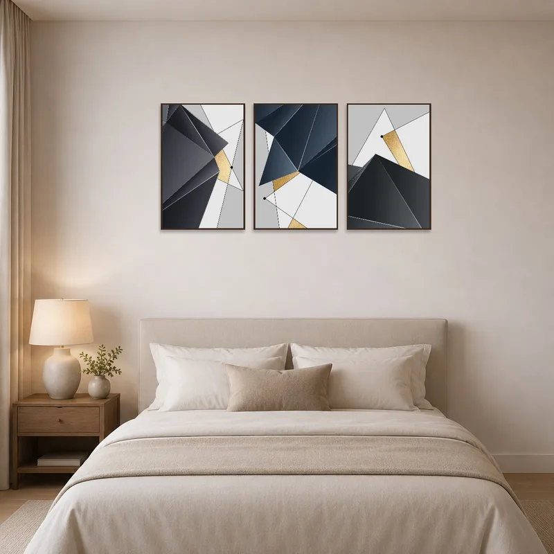 A geometric abstract gold and grey print displayed above the bed, complementing modern decor.