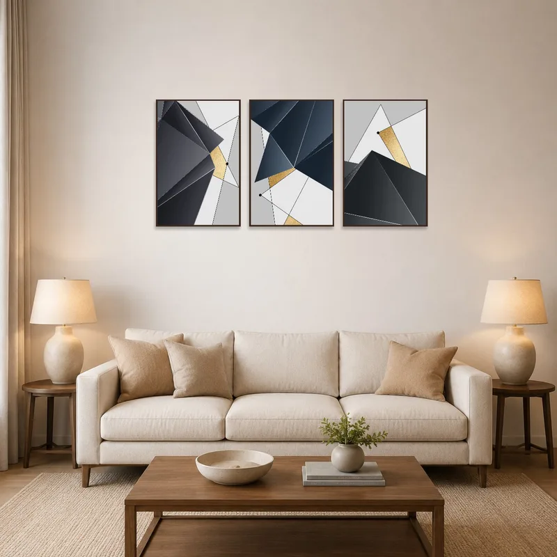 A geometric abstract gold and grey print on the wall above a modern sofa in the living room.