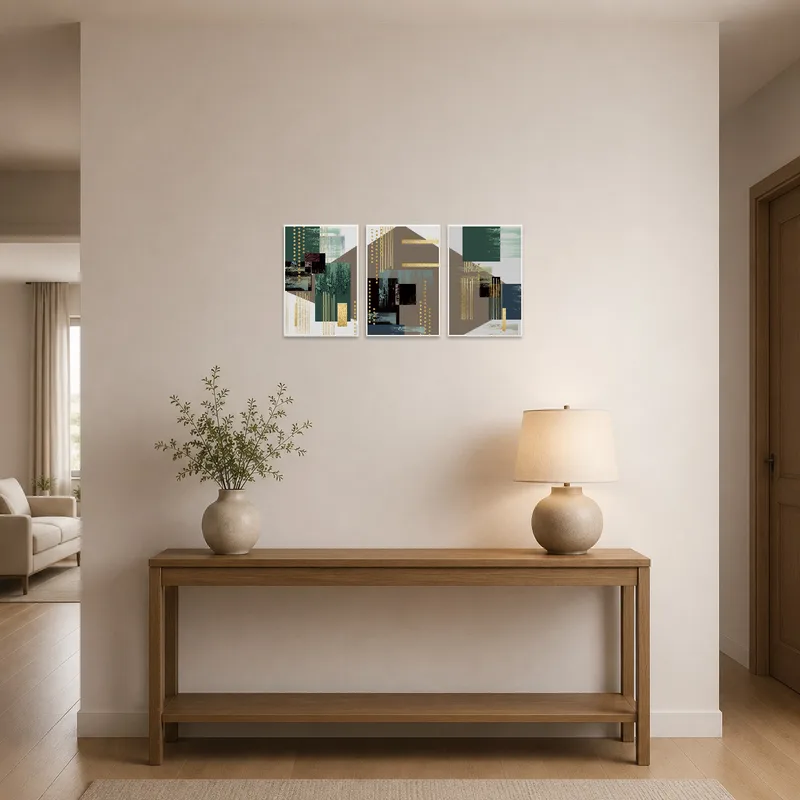 Gold-accented geometric abstract triptych creating a striking entrance hall focal point.