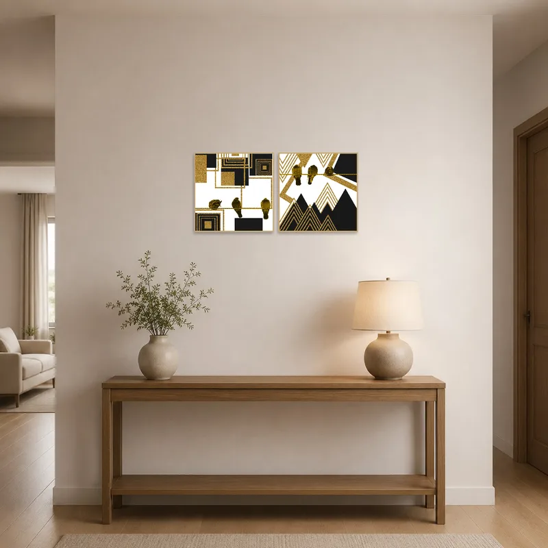 Geometric bird art set in gold and black welcomes guests in an elegant entrance hall.