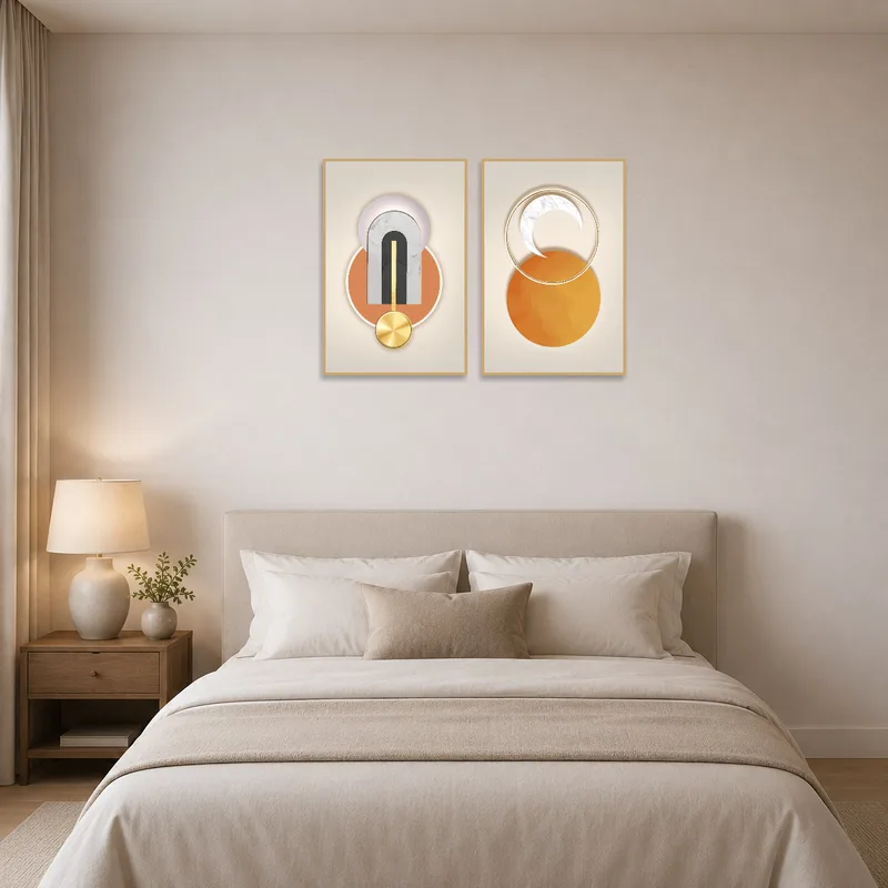 Geometric art duo set tastefully above a bed in a serene bedroom.